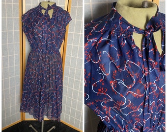 Vintage 1970’s does 1940’s semi sheer blue shirt sleeve dress with red and white squiggles