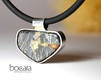 1 feather pyrite pendant in sterling silver setting and rubber strap