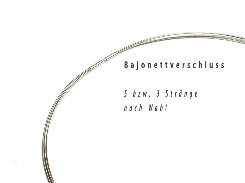 May include: A close-up of a silver-colored necklace with a bayonet clasp. The necklace is composed of multiple strands. Text in the image reads "Bajonettverschluss" and "5 bzw. 3 Str&auml;nge nach Wahl."