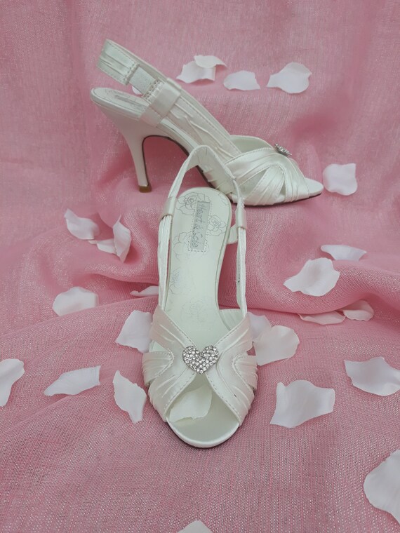 Ivory satin slingback peeptoe wedding shoes with crystal heart embellishment