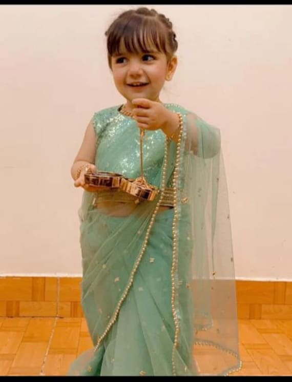 Small baby girl in saree outlet