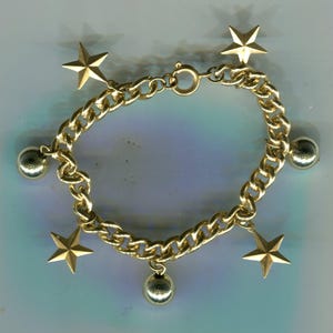 Brass charm bracelet with stars