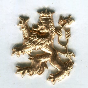 May include: A gold-colored metal lion with a crown on its head. The lion is standing on its hind legs with its front paws raised. The lion is a heraldic symbol.