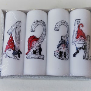 4 Danish Advent candles with numbers, one candle for each Advent weekend