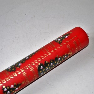 1 red Danish calendar candle 24 cm with fir trees and numbers 1 to 24