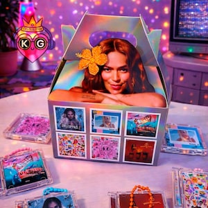 May include: A holographic box featuring a woman with red hair and a flower. The box displays six album covers. Several clear cases with colorful designs and beaded handles surround the box, suggesting a music theme.