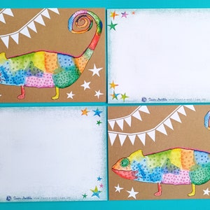 May include: Four cards with a colorful chameleon illustration. The chameleon is painted in rainbow hues and has a curled tail. White stars and a banner decorate the brown background. The cards have white blank spaces for writing.