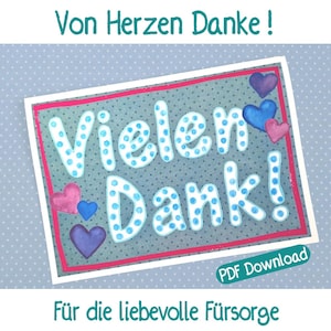 May include: A greeting card with the words "Vielen Dank!" in large, dotted letters. The card features blue, pink, and purple hearts, and the text "Von Herzen Danke!" and "Für die liebevolle Fürsorge" in teal. The card has a polka dot background.