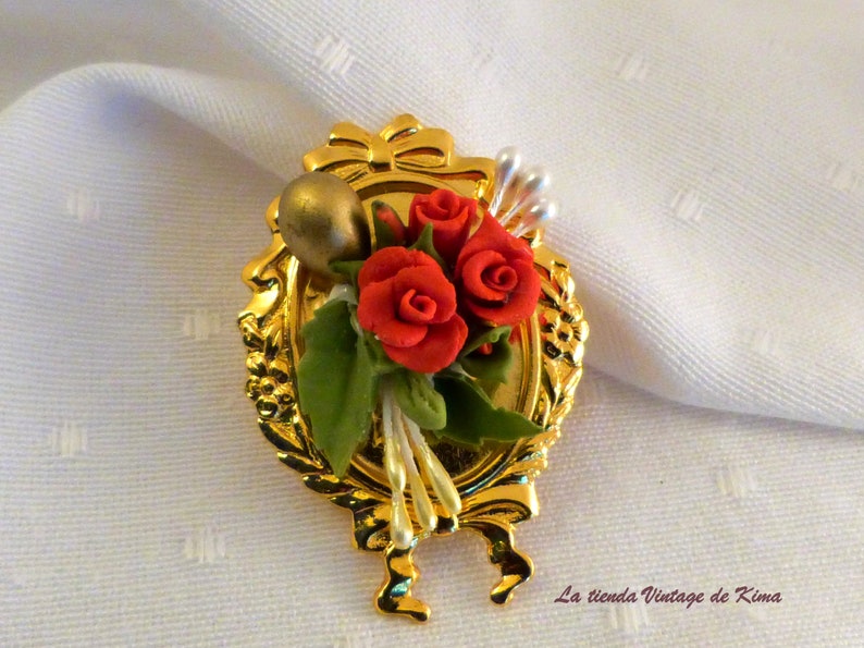 Golden brooch with red flowers image 3