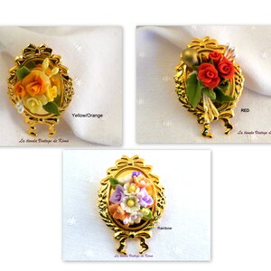 Golden brooch with red flowers image 2