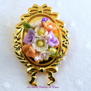 Golden brooch with red flowers image 1