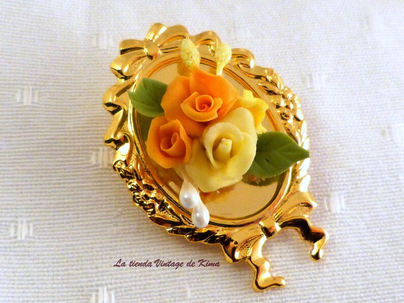 Golden brooch with red flowers image 4