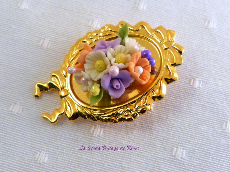 Golden brooch with red flowers image 8