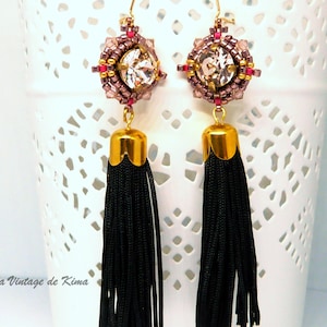 Long earrings with black pompom