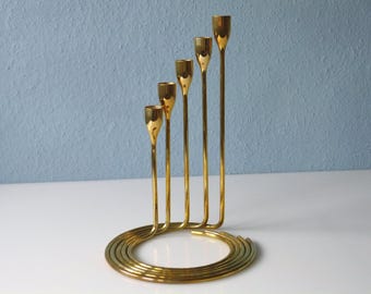 Set of nested brass candlesticks