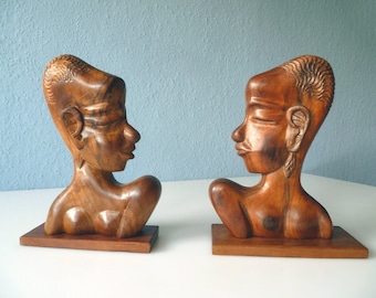 Wooden busts of African men and women