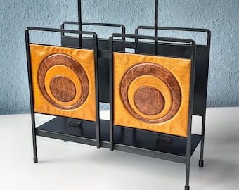 Stylish newspaper rack with Op Art design