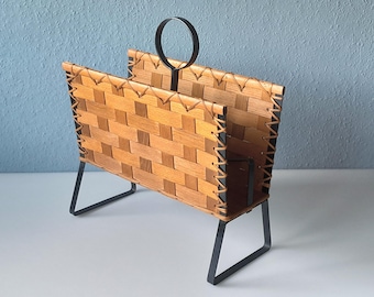 Newspaper rack from the 1960s with wickerwork