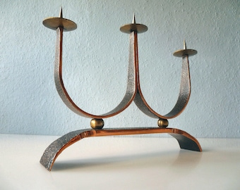 Stylish candlestick made of copper and brass