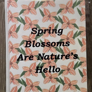 May include: A white card with a pink floral pattern and the text "Spring Blossoms Are Nature's Hello".
