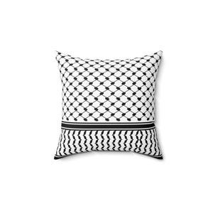 May include: Square cushion with a black and white geometric design. The pattern includes a grid of black dots and a border with a zig-zag pattern. This decorative cushion is suitable for a bed or sofa.