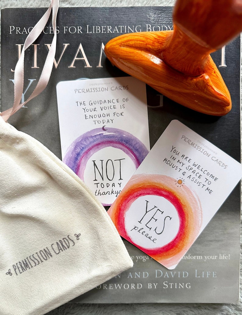 May include: A set of permission cards with watercolor backgrounds. The cards feature phrases like "The guidance of your voice is enough for today" and "You are welcome in my space to adjust & assist me". The cards are in a white cloth bag with the words "Permission Cards" printed on it.