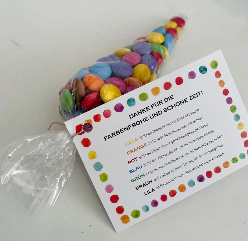 May include: A colorful thank you card with a rainbow of dots and the text "DANKE F&Uuml;R DIE FARBENFROHE UND SCH&Ouml;NE ZEIT!"  The card lists the colors of the rainbow and what they represent.  For example, "GELB is for the loving and heartfelt care."