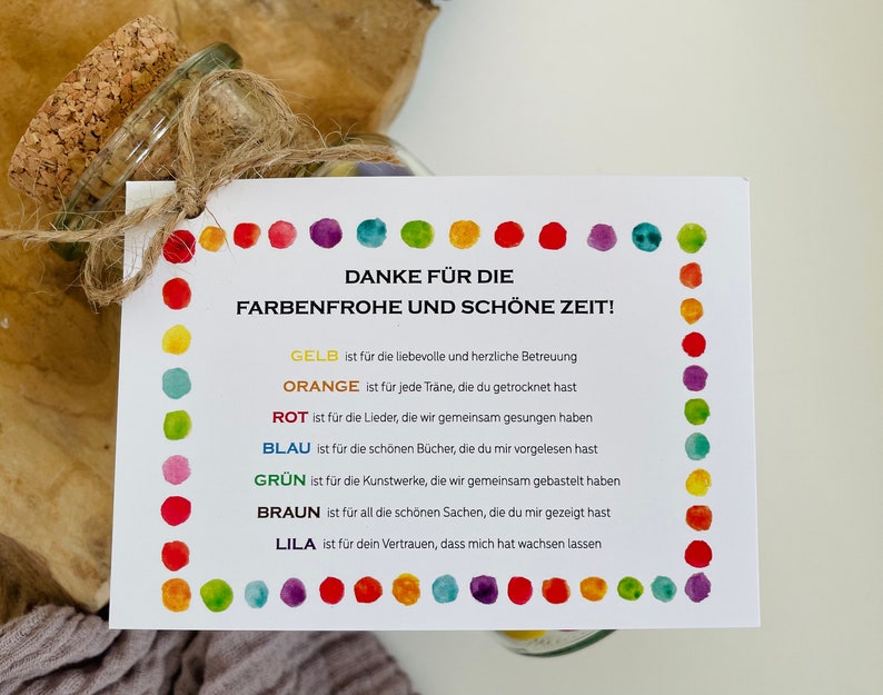 May include: A white card with colorful dots around the border. The card says "Danke f&uuml;r die Farbenfrohe und sch&ouml;ne Zeit!" and lists the colors yellow, orange, red, blue, green, brown, and purple with a short phrase describing what each color represents.