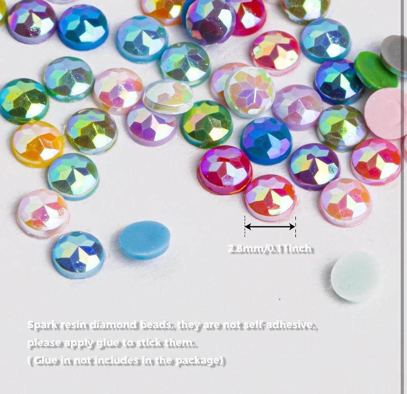 May include: Assortment of iridescent resin diamond beads in various colors, including pink, blue, green, and yellow. The beads are 2.8 mm in diameter and are not self-adhesive.  Spark resin diamond beads, they are not self-adhesive, please apply glue to stick them. (Glue in not includes in the package)
