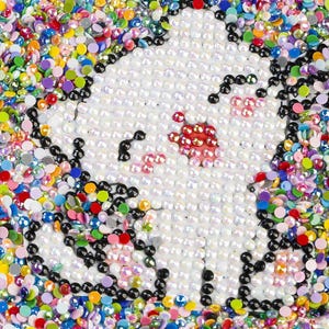 May include: A close-up of a white unicorn mosaic with iridescent and colorful beads surrounding it.