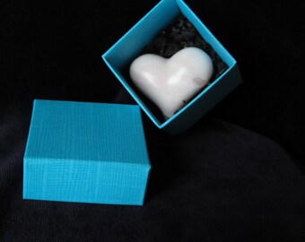 pink heart made of soapstone in a decorative box