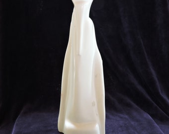 white sculpture made of soapstone, marabou