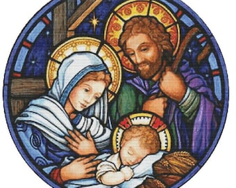 Peut inclure: Un motif de point de croix circulaire représentant la scène de la Nativité avec Marie, Joseph et l'enfant Jésus. Les personnages sont rendus dans des couleurs vives avec des auréoles dorées sur un fond bleu foncé, encadrés par une bordure circulaire.
