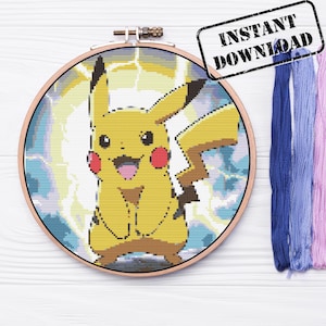 May include: A cross-stitch pattern of Pikachu, a yellow electric-type Pokemon, with a blue and white background. The pattern is in a round embroidery hoop.