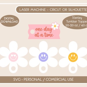 May include: Digital download of daisy-shaped Stanley tumbler toppers with smiley faces in pink, purple, and yellow. The toppers have the text "one day at a time" on a pink tag. The image also includes text that says "Laser Machine - Cricut or Silhouette".
