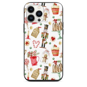 May include: A white iPhone case with a Christmas-themed design. The design features gingerbread men, nutcrackers, candy canes, and other holiday treats. The case is black on the edges.