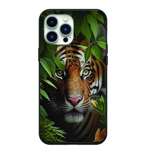 May include: A black phone case with a tiger peeking through green leaves. The tiger has orange and black stripes and green eyes.