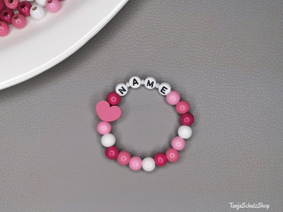 Children s bracelet made of wooden beads with names