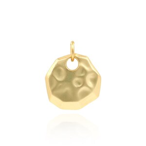 May include: Gold-toned pendant with a textured, irregular circular shape and a small hole at the top for attaching a chain.