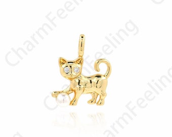 May include: A gold charm in the shape of a cat playing with a pearl. The cat has a diamond for each eye.