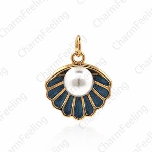 May include: A gold-tone pendant charm shaped like a seashell with a white pearl in the center. The seashell is decorated with blue enamel and has a detailed design.