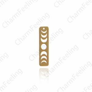 May include: Gold-toned metal charm featuring a crescent moon design with eight phases of the moon. The charm is rectangular and has a hole at the top for attaching to a necklace or bracelet.
