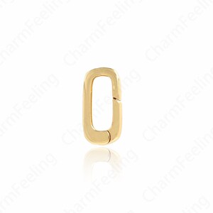 May include: A gold-colored, rectangular clasp with rounded corners. The clasp is open, revealing a hinged mechanism. The background is white, with the words "CharmFeeling" repeated in the background.