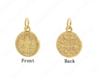 May include: Gold-toned pendant featuring a Saint Christopher medal with a detailed image of Saint Christopher carrying the Christ child on his shoulders on the front and a cross with the letters 'S.P.Q.R.' on the back.