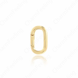 May include: Gold-toned metal oval-shaped clasp with a spring-loaded closure.