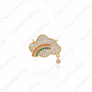 May include: Gold-tone charm featuring a cloud with a rainbow design, accented with clear and colored crystals. The charm has a dangling crystal drop.
