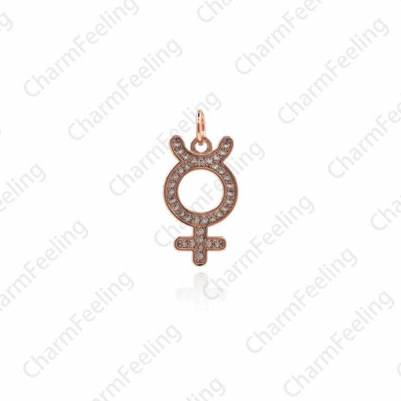 May include: A rose gold charm pendant featuring a female symbol with a circle and cross design. The charm is adorned with clear sparkling rhinestones.