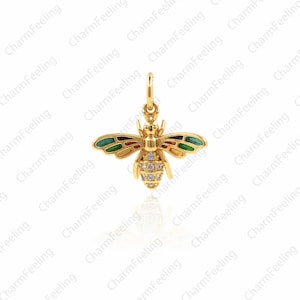 May include: A gold bee charm with green, red and yellow enamel accents and clear rhinestones. The bee is a popular symbol of hard work and community.