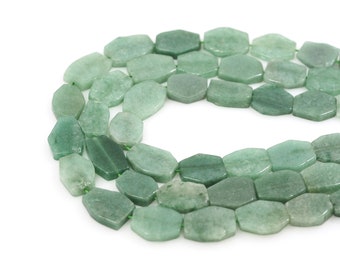 May include: A strand of green jade gemstone beads, each bead is faceted and has a hexagonal shape.