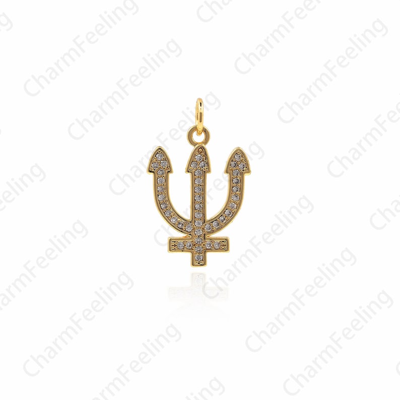 May include: A gold trident charm with clear crystals. The charm is a popular symbol of the sea and is perfect for adding a touch of nautical style to any jewelry piece.